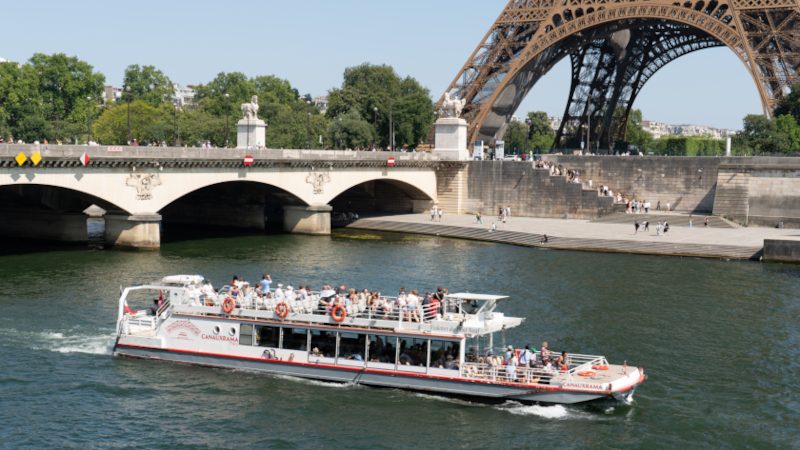 Canauxrama canal cruise boat passing through a lock